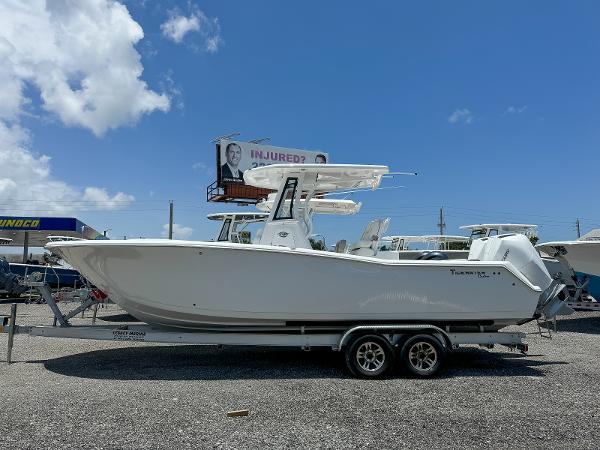 Tidewater 272 CC Adventure 2026 Tidewater 272 CC Adventure boat on trailer under clear blue sky.