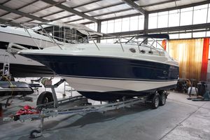 Regal Commodore 2660 1999 Regal Commodore 2660 boat on trailer in indoor storage facility.