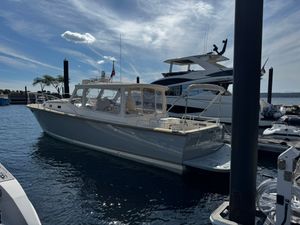 MJM 40z 2014 MJM 40z yacht docked at marina under a partly cloudy sky.