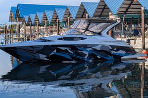 Regal 3360 Window Express 2008 Regal 3360 Window Express boat with modern geometric design docked at marina.