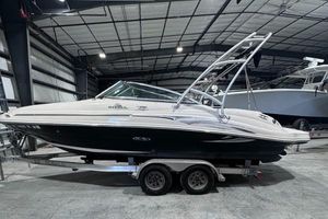 Sea Ray 220 Sundeck 2005 Sea Ray 220 Sundeck boat on trailer in indoor storage facility.
