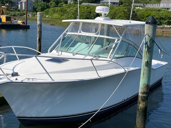 Albemarle 31 2008 Albemarle 31 boat docked in a serene marina setting.