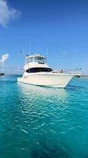 Tiara Yachts 48 Convertible 2015 Tiara Yachts 48 Convertible on clear turquoise water under a bright blue sky.