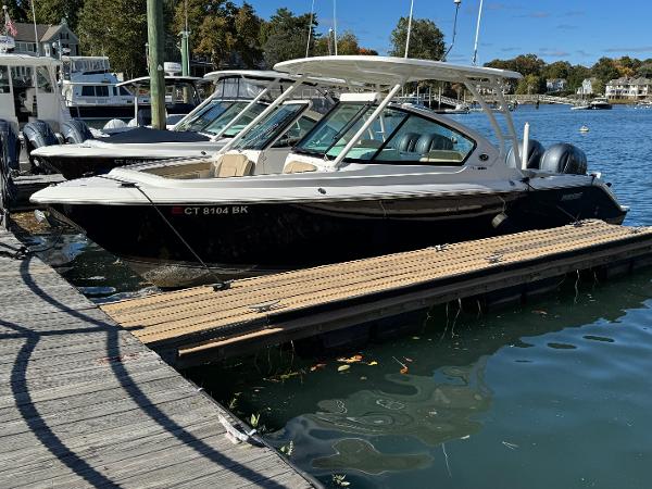 Pursuit DC 266 Dual Console 2020 Pursuit DC 266 Dual Console boat docked in a marina.