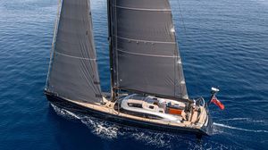 Shipman 72 Sailing yacht Shipman 72, 2009 model, gliding on open sea with sleek black sails.