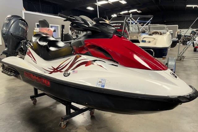 Sea-Doo GTI SE 130 2008 Sea-Doo GTI SE 130 jet ski with red and white design in a showroom.