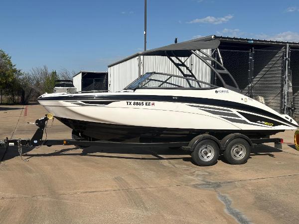 Yamaha Boats AR210 2018 Yamaha AR210 boat on trailer, parked outdoors under clear sky.