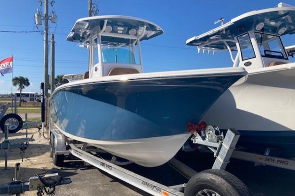Sea Pro 239 Sport CC 2023 Sea Pro 239 Sport CC boat on a trailer in a marina.