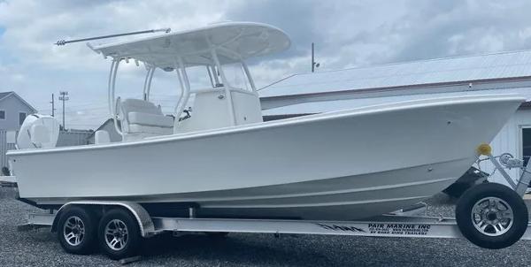 Pair Customs 24DV 2025 Pair Customs 24DV boat on trailer, side view.