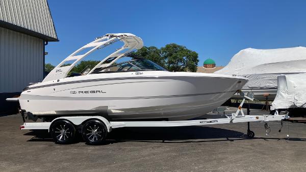 Regal LS2 2024 Regal LS2 boat on a trailer, parked outdoors.
