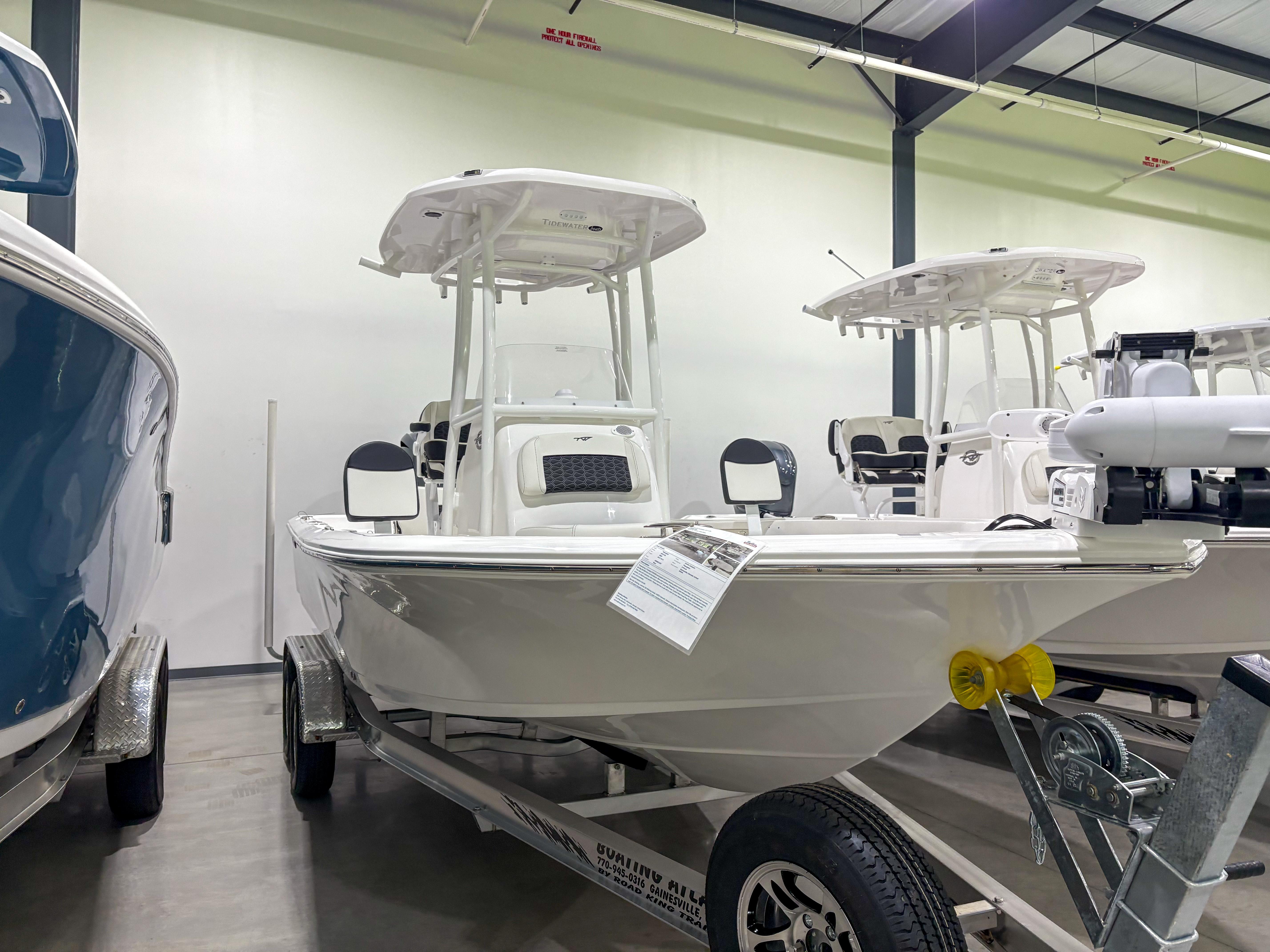 Tidewater 2210 Cb 2025 Tidewater 2210 Cb boat displayed indoors on a trailer.