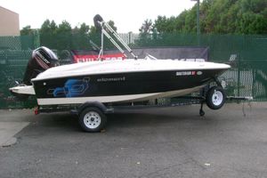Bayliner Element E16 2019 Bayliner Element E16 boat on trailer, parked outdoors with Mercury outboard motor.