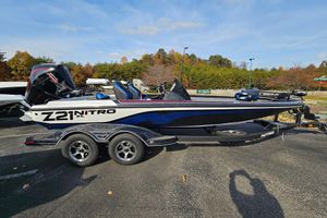 Nitro Z21 XL Pro 2026 Nitro Z21 XL Pro boat on trailer, parked outdoors, showcasing sleek design and modern features.