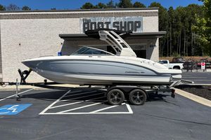 Chaparral 23 Surf 2021 Chaparral 23 Surf boat on trailer outside dealership, side view.