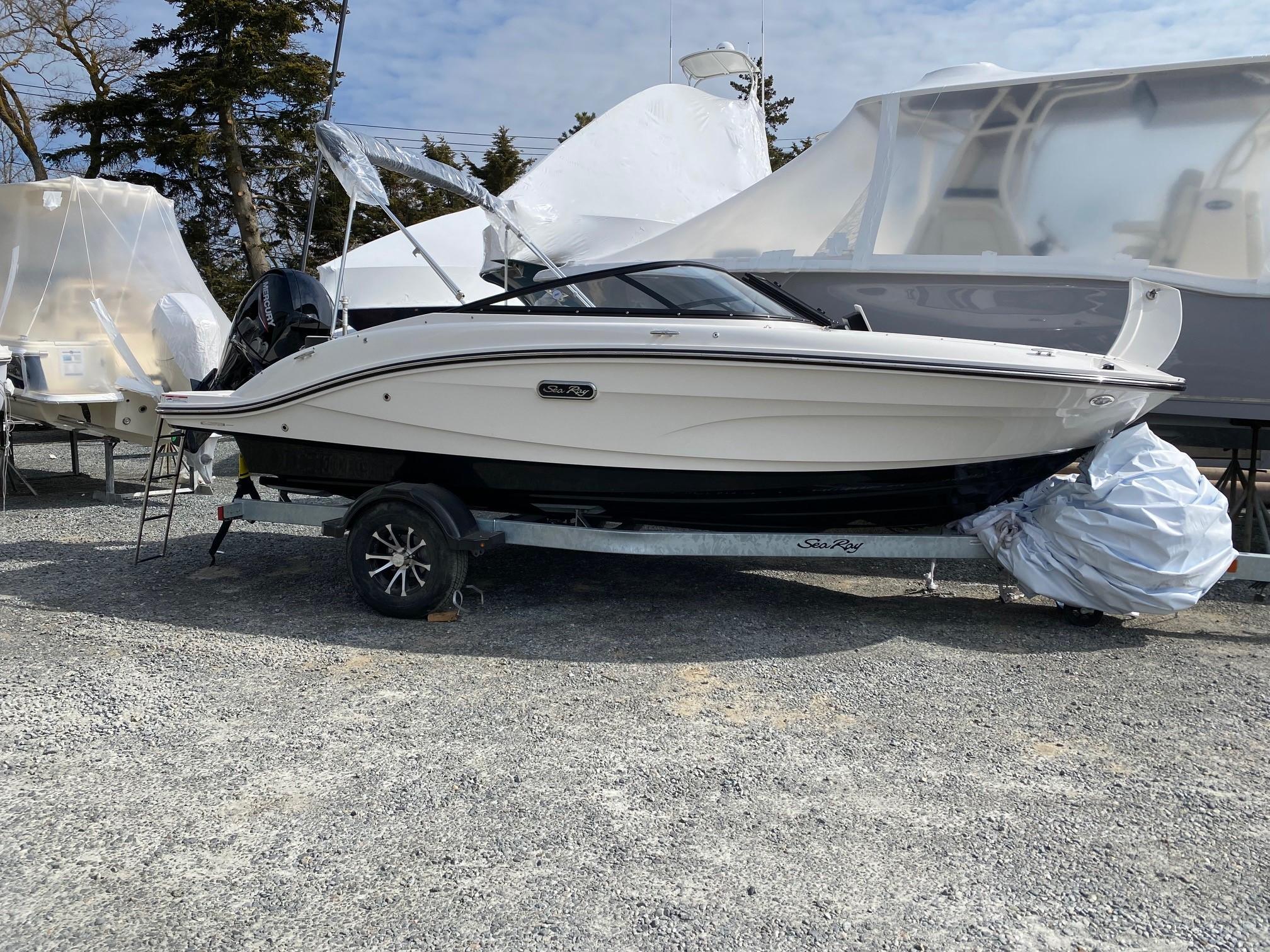 Sea Ray SPX 190 Outboard 2025 Sea Ray SPX 190 Outboard boat on trailer, parked outdoors.