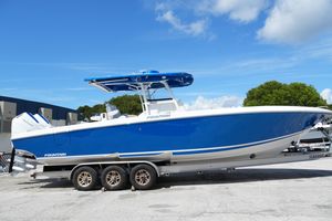 Fountain 34 Center Console 2023 Fountain 34 Center Console boat in vibrant blue on a trailer.