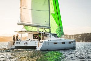 Vision 444 Sailing catamaran Vision 444, 2026 model, with green sails on a sunny day.