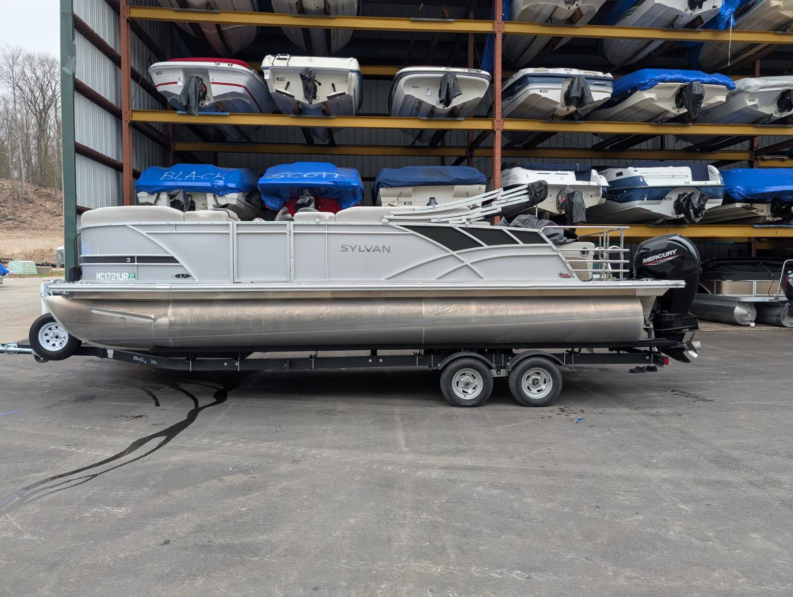 Sylvan L3 DLZ Bar 2022 Sylvan L3 DLZ Bar pontoon boat on trailer in storage facility.