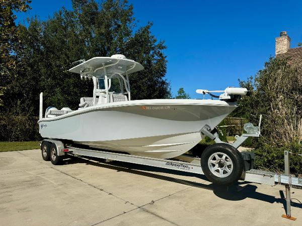 Yellowfin 26 Hybrid 2020 Yellowfin 26 Hybrid boat on trailer, parked outdoors.