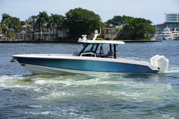 Boston Whaler 380 Outrage 2024 Boston Whaler 380 Outrage cruising on a scenic waterway.