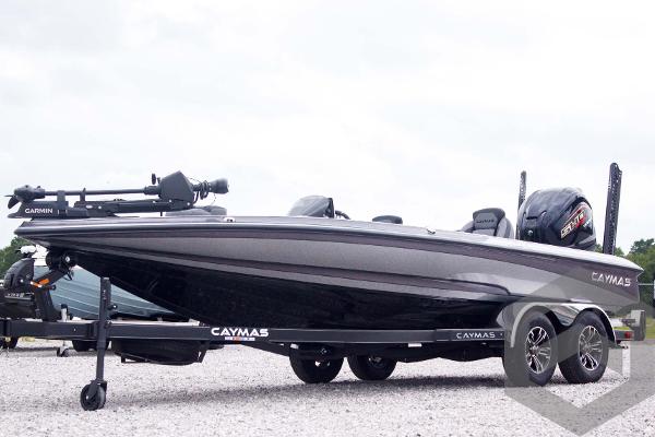 Caymas CX 21 PRO 2025 Caymas CX 21 PRO boat on trailer, sleek design, parked on gravel.