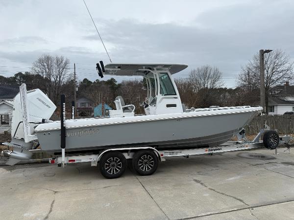 Everglades 253 Center Console 2025 Everglades 253 Center Console boat on trailer, parked outdoors.
