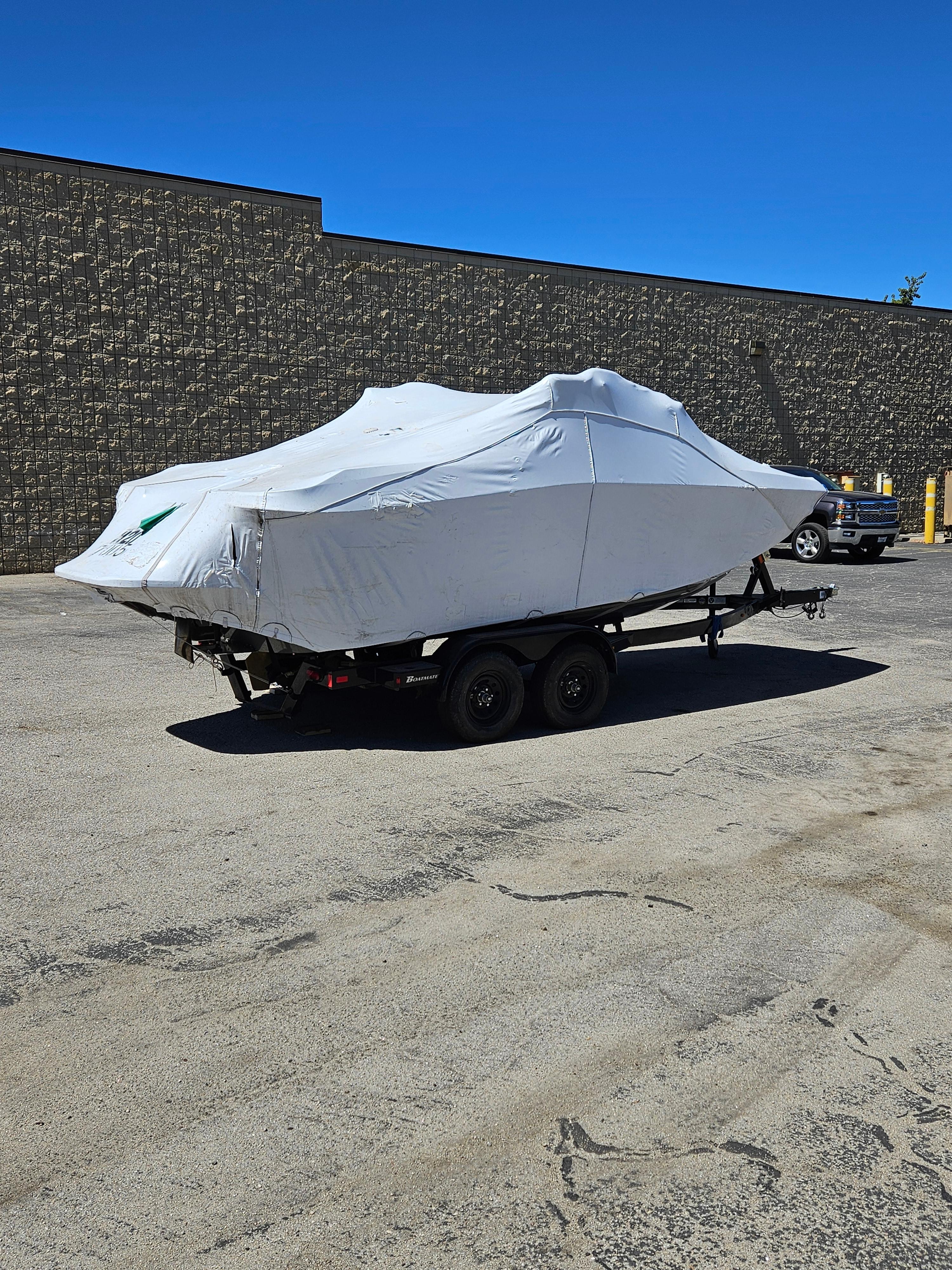HEYDAY WAKE BOATS H20 2023 HEYDAY WAKE BOATS H20 covered on trailer in parking lot.