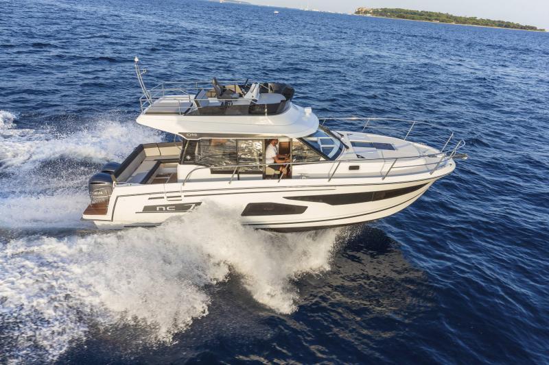 Jeanneau NC 1095 2026 Jeanneau NC 1095 cruising on open sea, showcasing sleek design and performance.