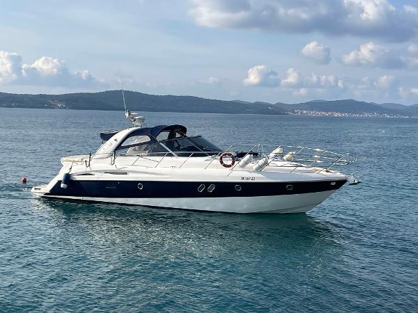 Cranchi Mediterranee 47 2005 Cranchi Mediterranee 47 yacht on calm sea with scenic mountain backdrop.
