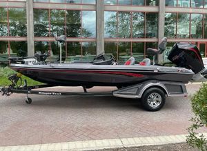 Ranger Z518 2025 Ranger Z518 boat on trailer, sleek design, parked outdoors.