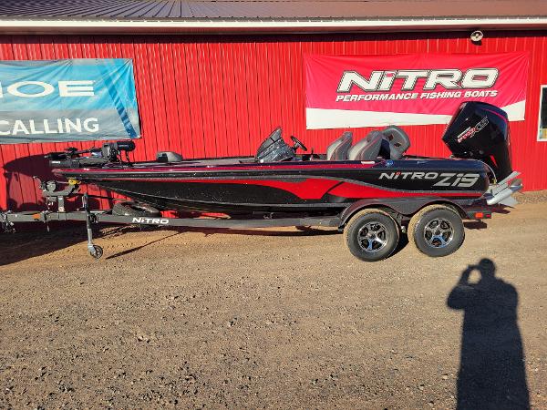 Nitro Z19 Pro 2024 Nitro Z19 Pro fishing boat in black and red, parked on a trailer.