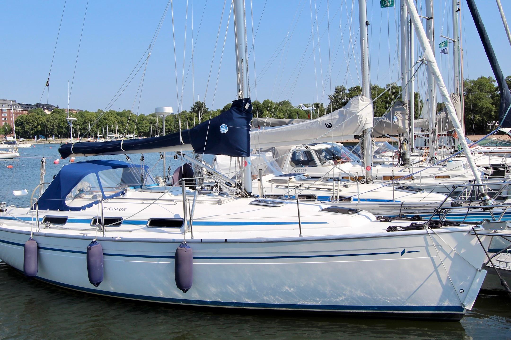 Bavaria 34 2002 Bavaria 34 sailboat docked in a marina, surrounded by other boats.