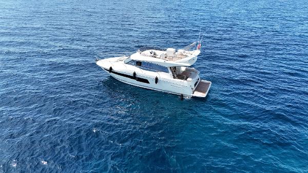 Prestige 460 Luxury 2023 Prestige 460 yacht cruising on open blue sea.