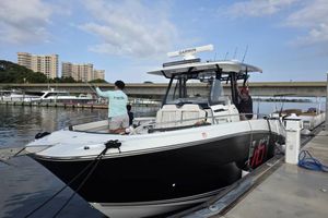 Jeanneau Leader 10.5 CC 2024 Jeanneau Leader 10.5 CC boat docked at marina with people onboard.