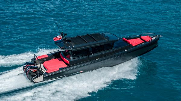 Axopar Shadow 900 XC BRABUS 2021 Axopar Shadow 900 XC BRABUS cruising on blue ocean waters.