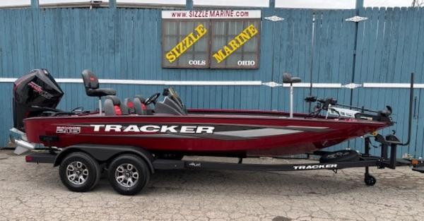 Tracker Savage 215 2025 Tracker Savage 215 boat on trailer, red and black design, displayed at Sizzle Marine.