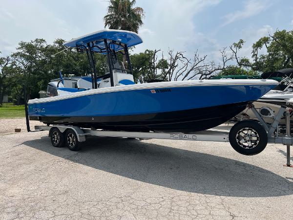 Robalo 246 Cayman 2018 Robalo 246 Cayman boat on trailer, blue and black design, parked outdoors.