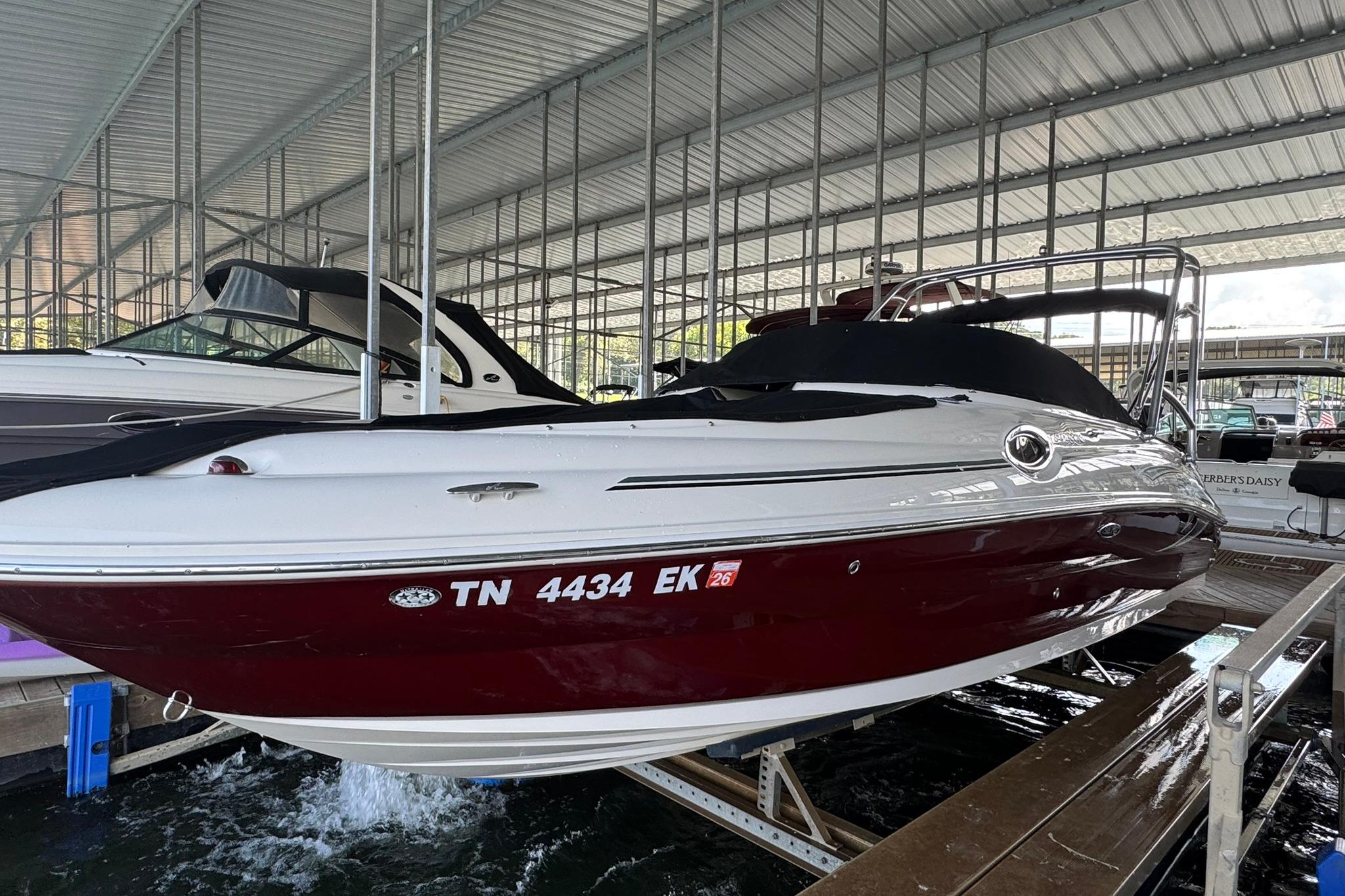 Sea Ray 240 Sundeck 2006 Sea Ray 240 Sundeck boat docked in a covered marina.