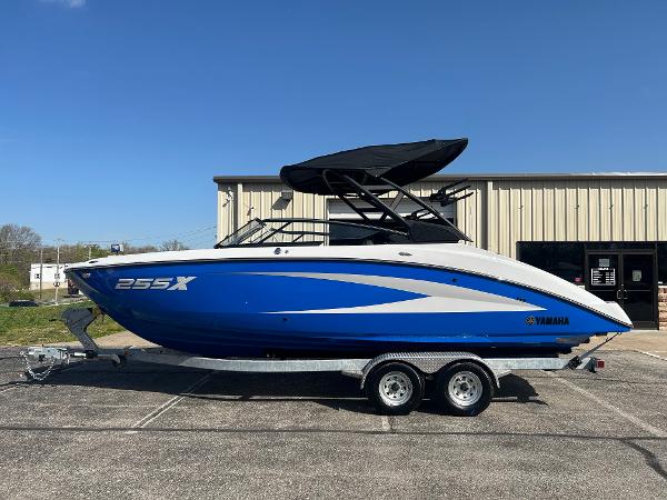 Yamaha Boats 255XD 2025 Yamaha Boats 255XD in blue on a trailer, parked outdoors.