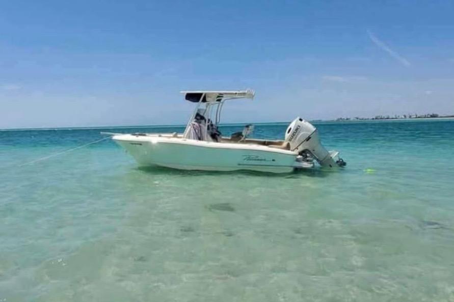 Pioneer 202 Islander 2019 Pioneer 202 Islander boat anchored in clear turquoise water.