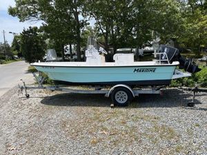Maritime Skiff 189 Defiant 2022 Maritime Skiff 189 Defiant boat on trailer, parked outdoors on gravel.