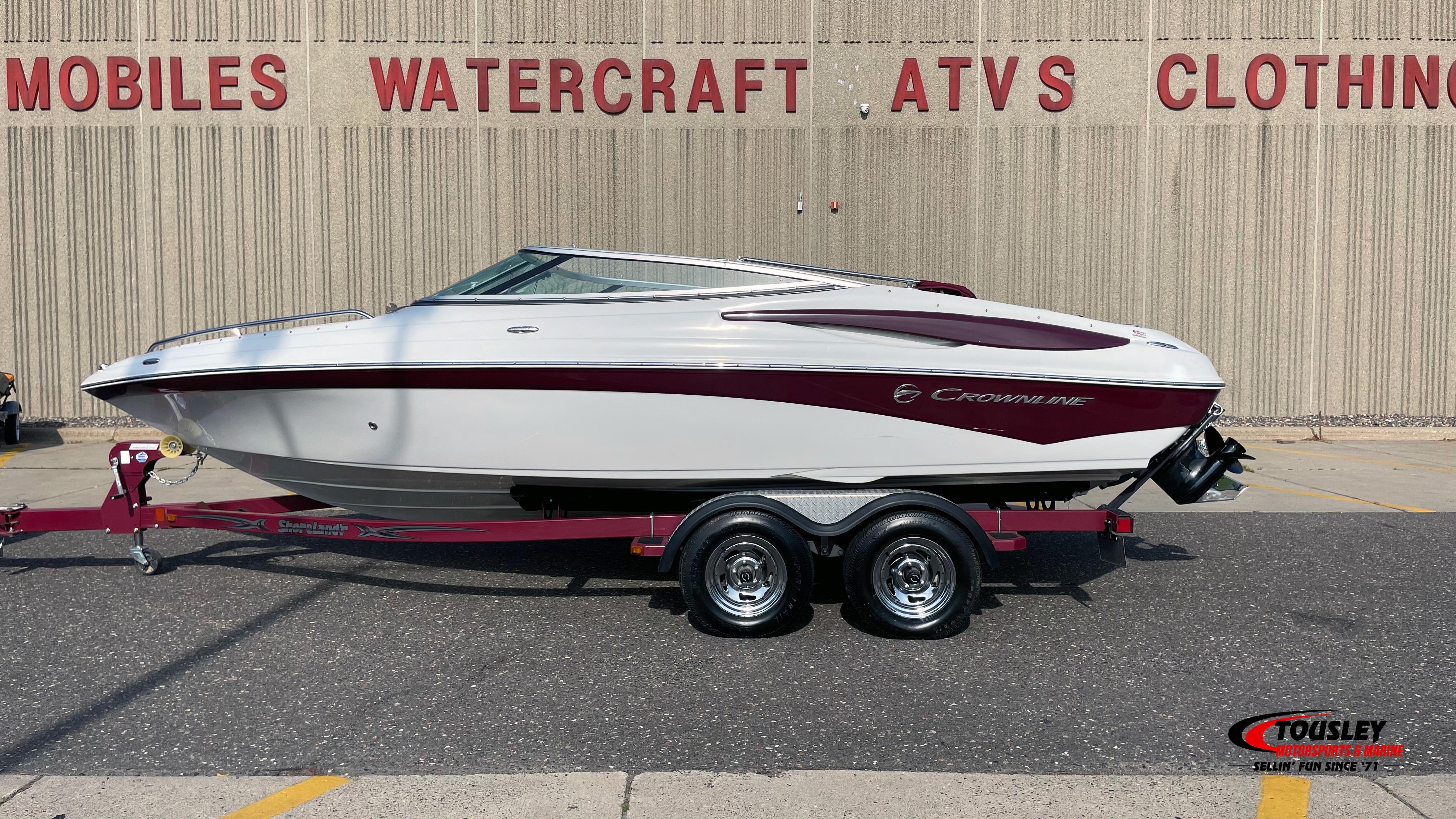 Crownline 21SS 2011 Crownline 21SS boat on trailer, parked outside dealership.