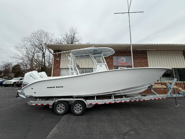 Cape Horn 28 XS 2025 Cape Horn 28 XS boat on trailer, parked outside a building.