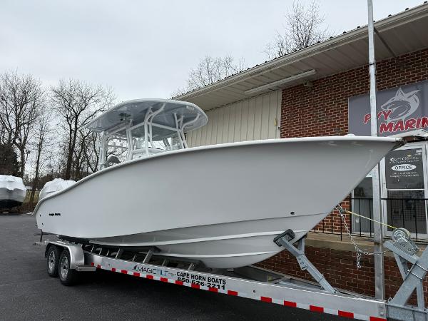 Cape Horn 28 XS 2025 Cape Horn 28 XS boat on trailer outside a marine dealership.