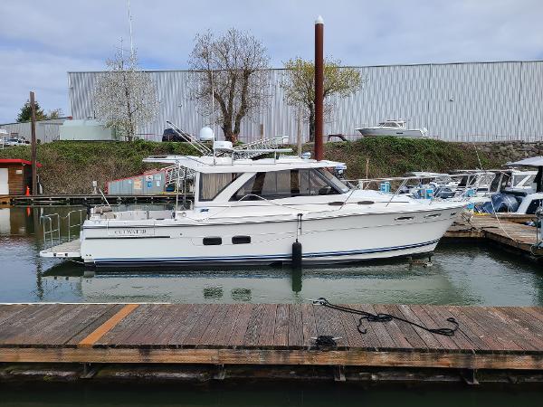 Cutwater C-30 Sedan NW Edition 2023 Cutwater C-30 Sedan NW Edition docked at a marina, side view.