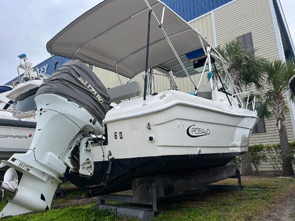 Robalo 2440 Walkaround 2000 Robalo 2440 Walkaround boat on display, featuring outboard motor and canopy.