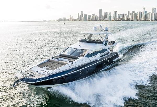 Azimut 66 Luxury 2017 Azimut 66 yacht cruising near city skyline.