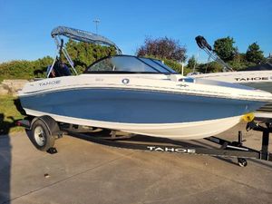 Tahoe 185 S 2024 Tahoe 185 S boat on trailer, parked outdoors.