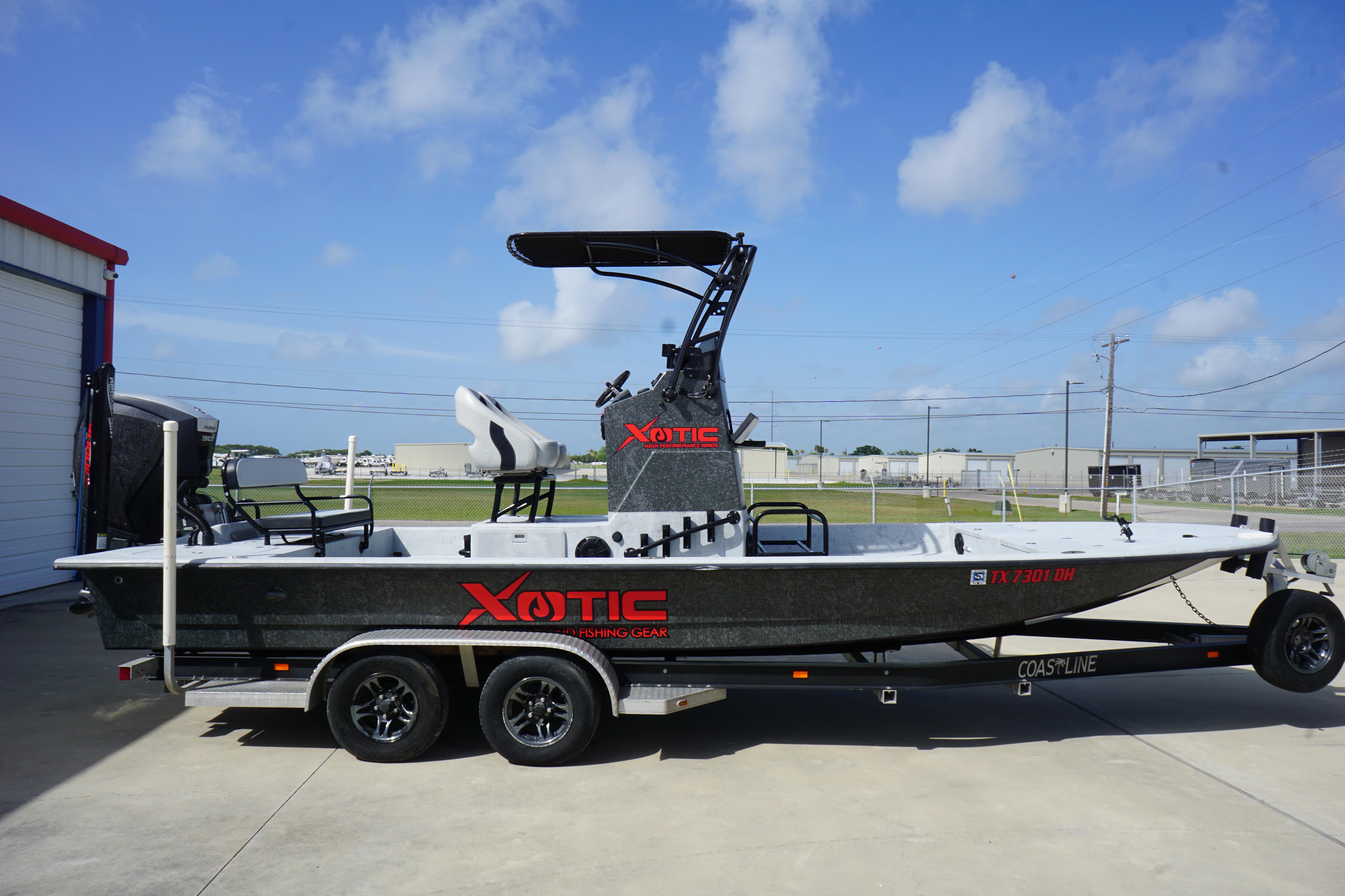 El Pescador 24 CAT 2015 El Pescador 24 CAT boat on trailer, featuring Xotic fishing gear branding.