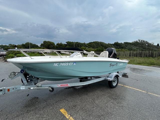 Boston Whaler 160 Super Sport 2023 Boston Whaler 160 Super Sport boat on trailer, parked outdoors.